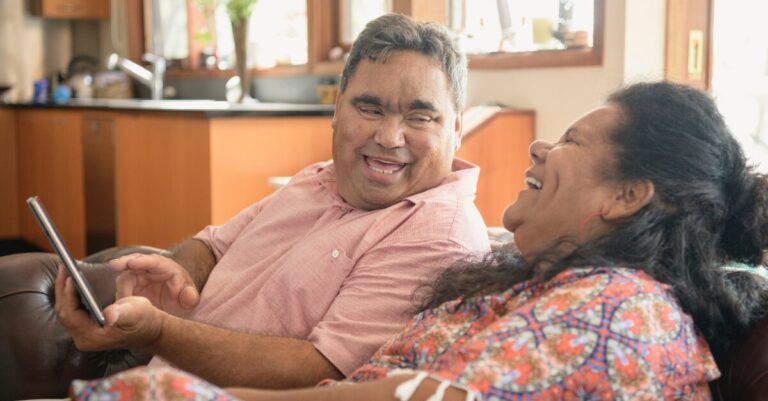 First Nations Australian people sitting together, laughing