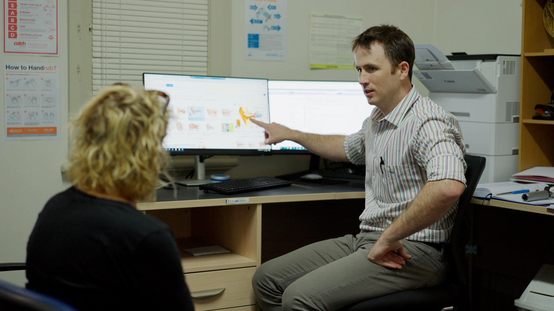 GP Registrar with a patient in consult room