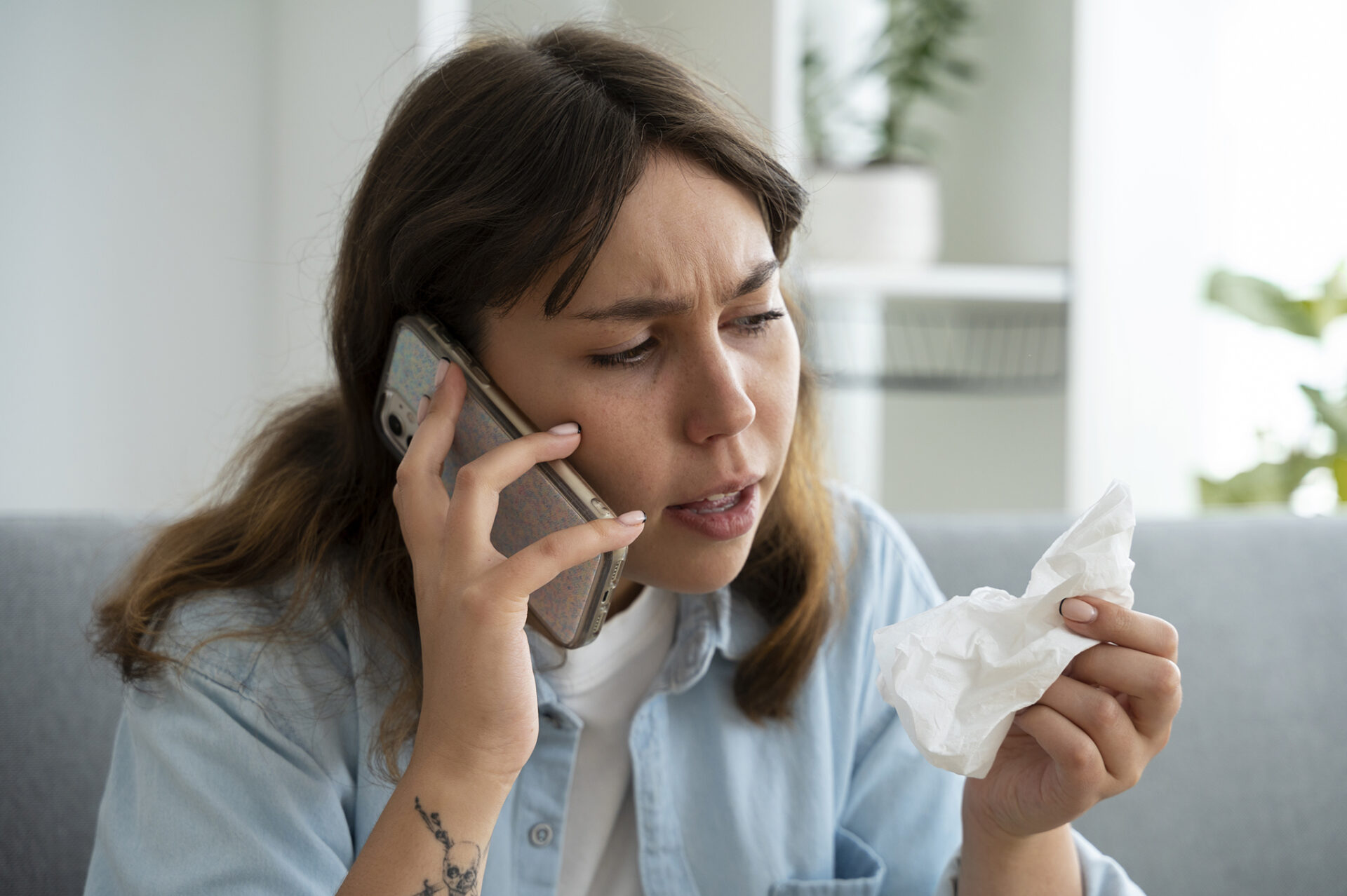 sick woman talking on phone